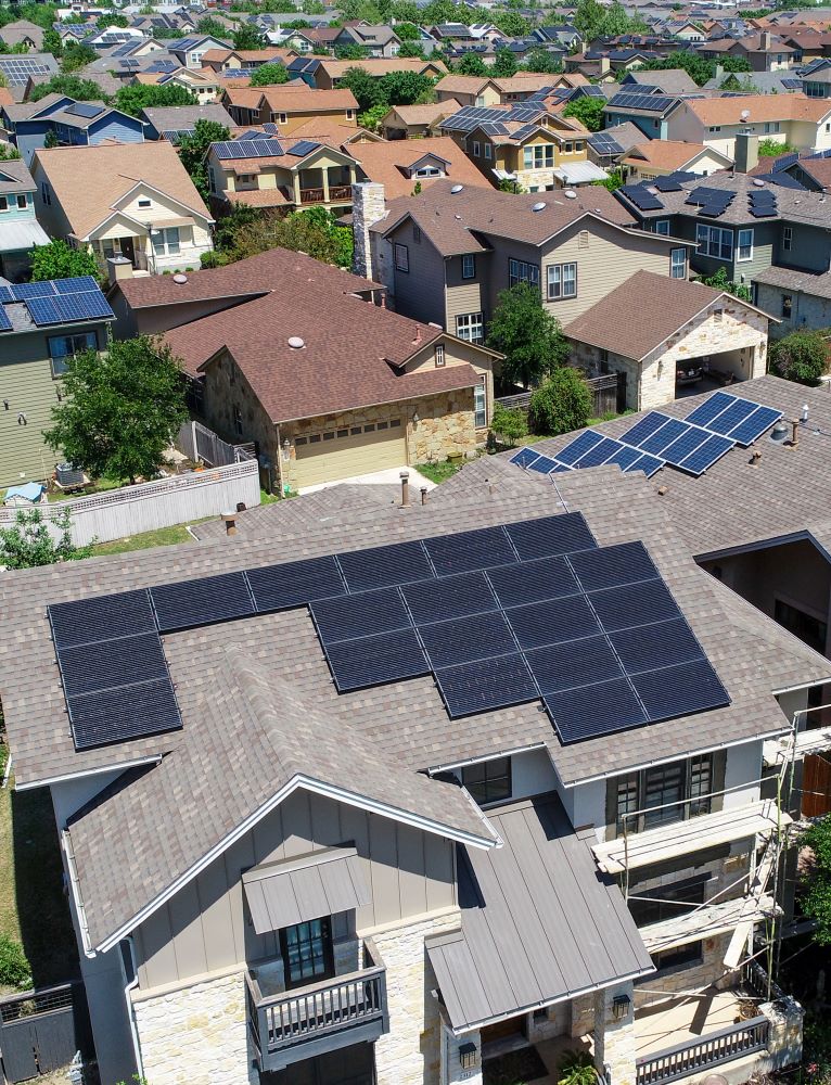 3-Aerial View of Residences With Solar Panel on Rooves shutterstock_1069925930 verticle Solar Panels Impact on Power Grid