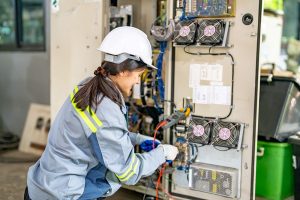 6 female-worker-working-on-a-machine-in-factory-2023-11-27-05-06-25-utc