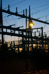 shot-of-street-light-held-on-an-electricity-wires-2023-11-27-05-15-27-utc substation at dusk